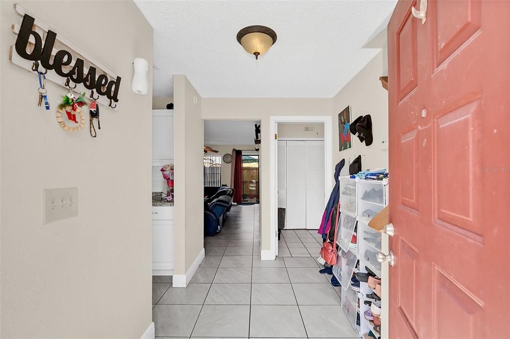 1612 Sandy Point Square, Unit 56 Orlando, FL 32807 - Photo 3 of 26 a view of a livingroom with storage & utility