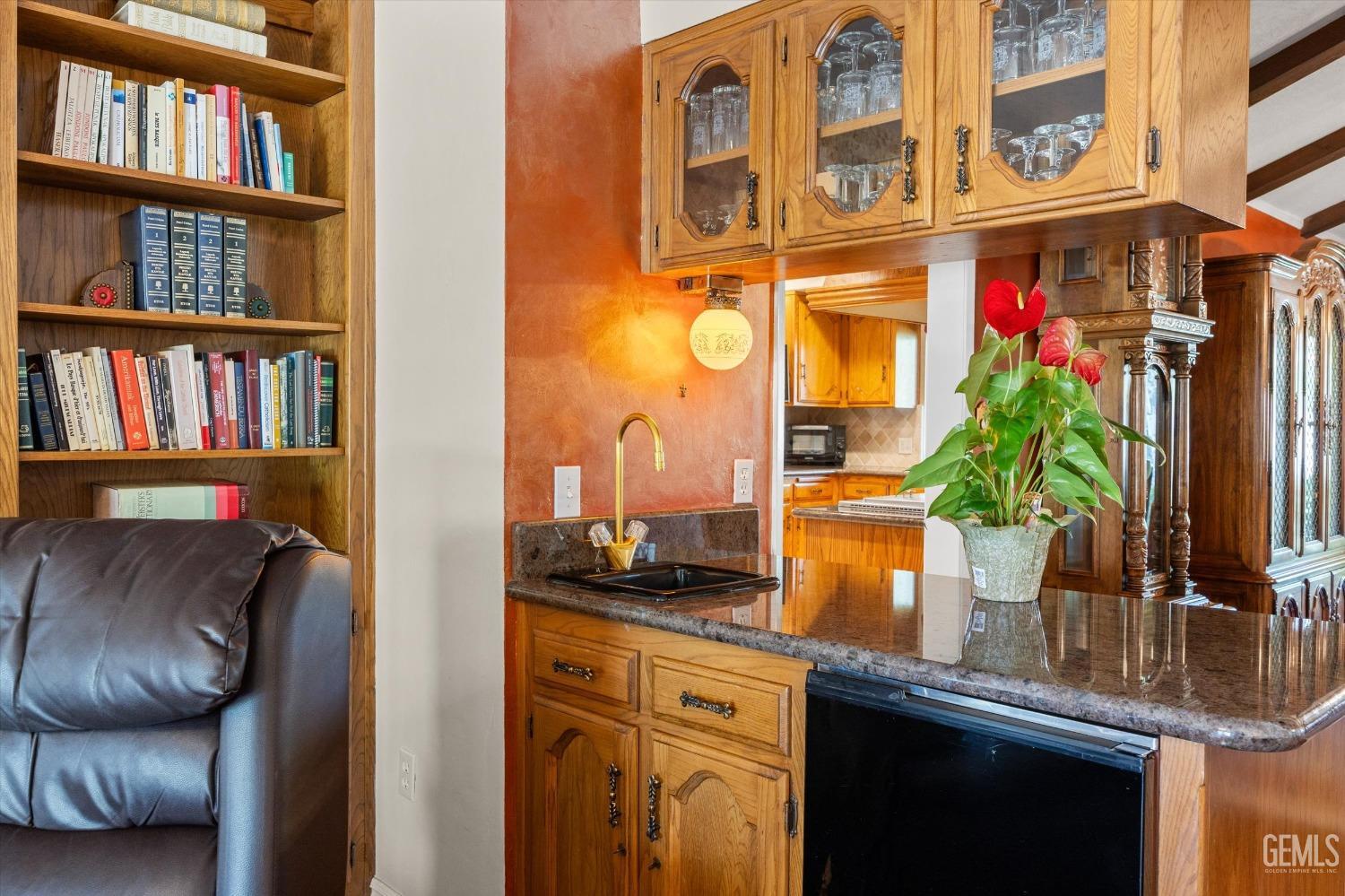 Undisclosed Address Bakersfield, CA 93313 - Photo 12 of 45 a kitchen with a refrigerator and a potted plant