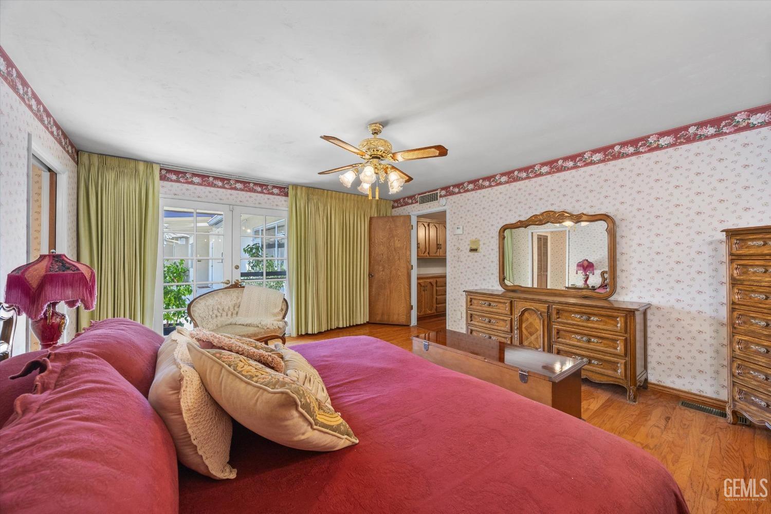 Undisclosed Address Bakersfield, CA 93313 - Photo 28 of 45 a bed room with a bed and a chandelier