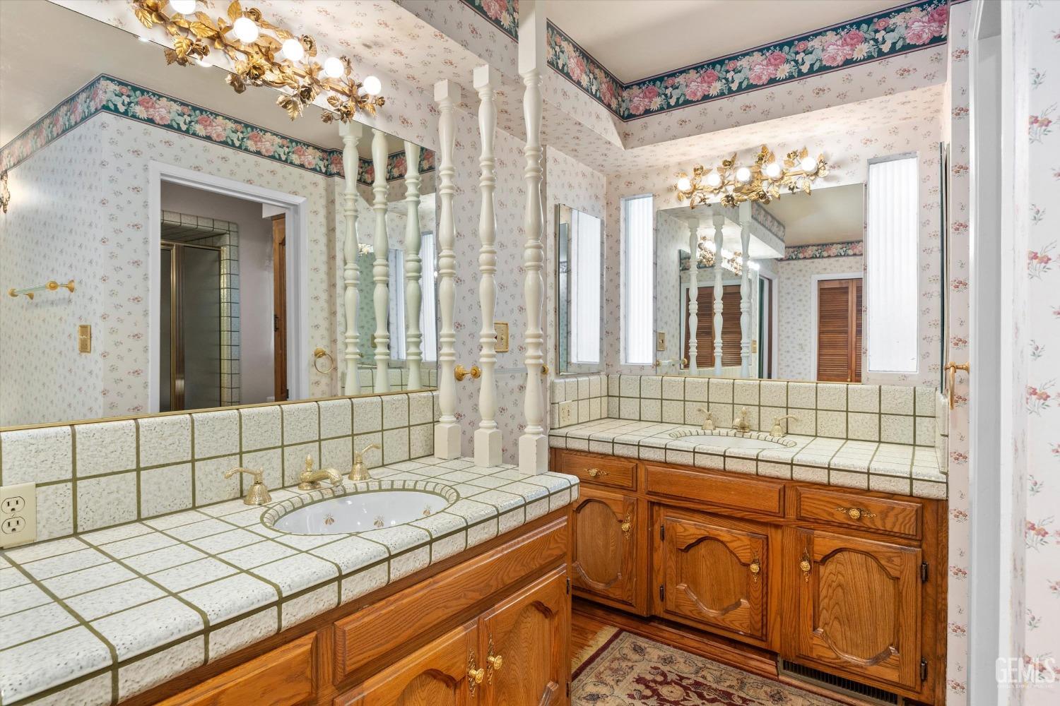 Undisclosed Address Bakersfield, CA 93313 - Photo 30 of 45 a bathroom with a sink and a mirror