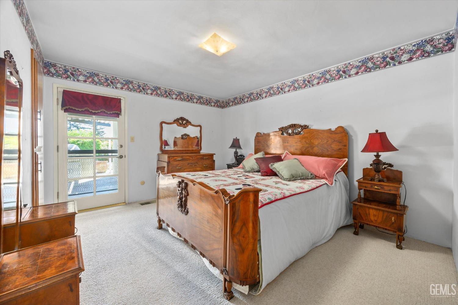 Undisclosed Address Bakersfield, CA 93313 - Photo 34 of 45 a bed room with a bed and a chair