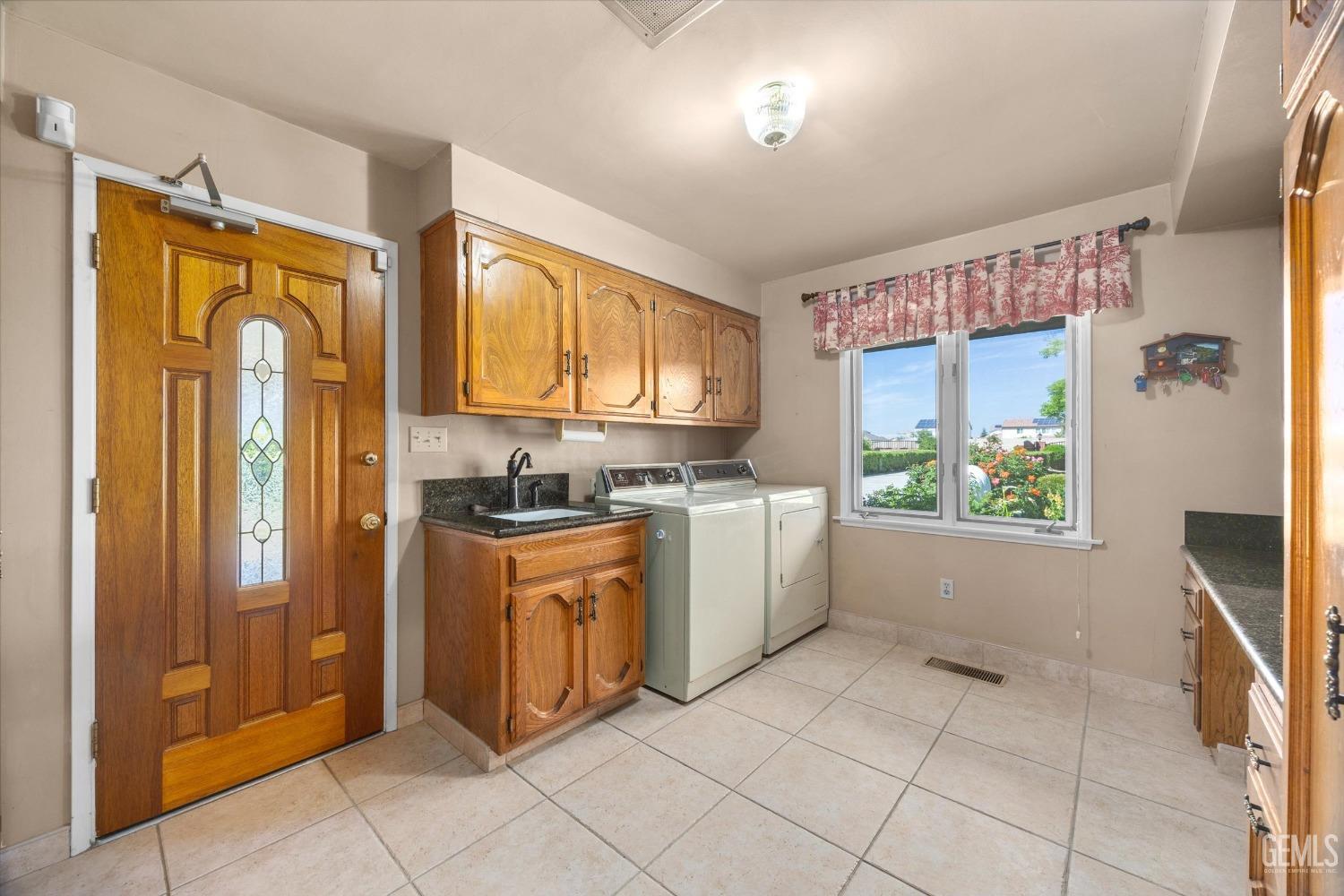 Undisclosed Address Bakersfield, CA 93313 - Photo 36 of 45 a large kitchen with stainless steel appliances granite countertop a refrigerator and a sink