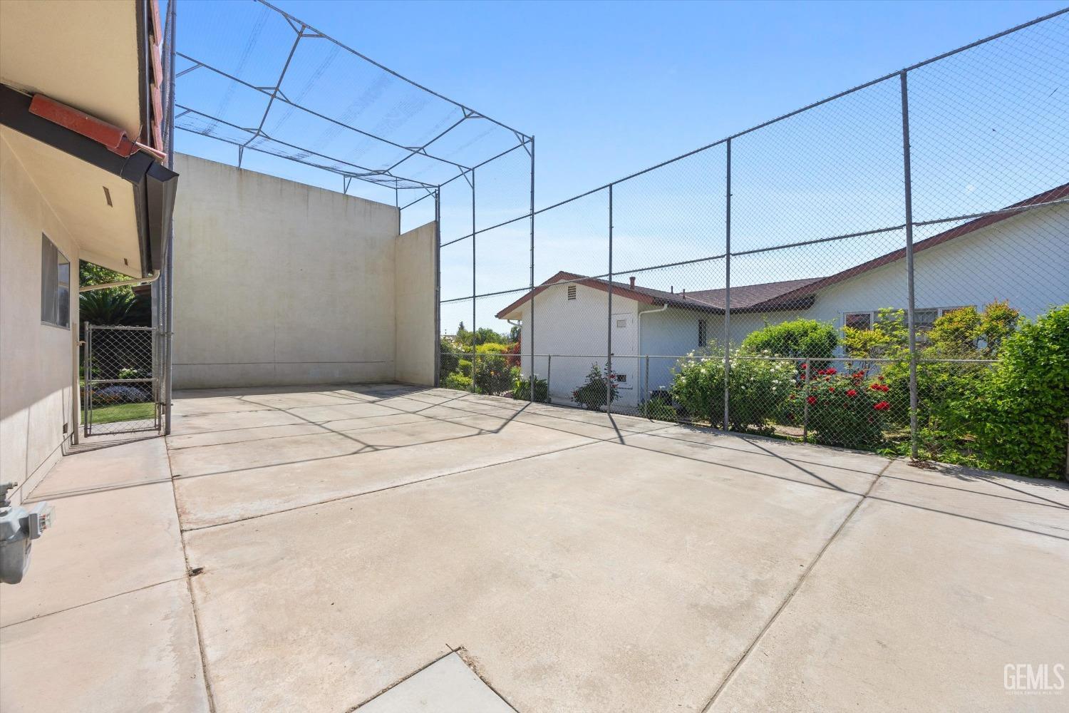 Undisclosed Address Bakersfield, CA 93313 - Photo 44 of 45 a house with a yard and potted plants
