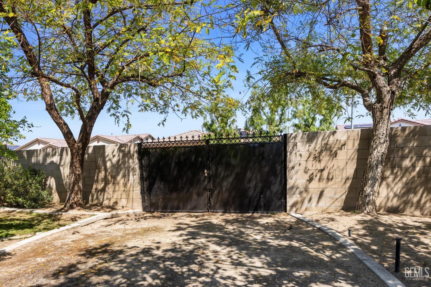 Undisclosed Address Bakersfield, CA 93313 - Photo 45 of 45 a view of a backyard with a large tree