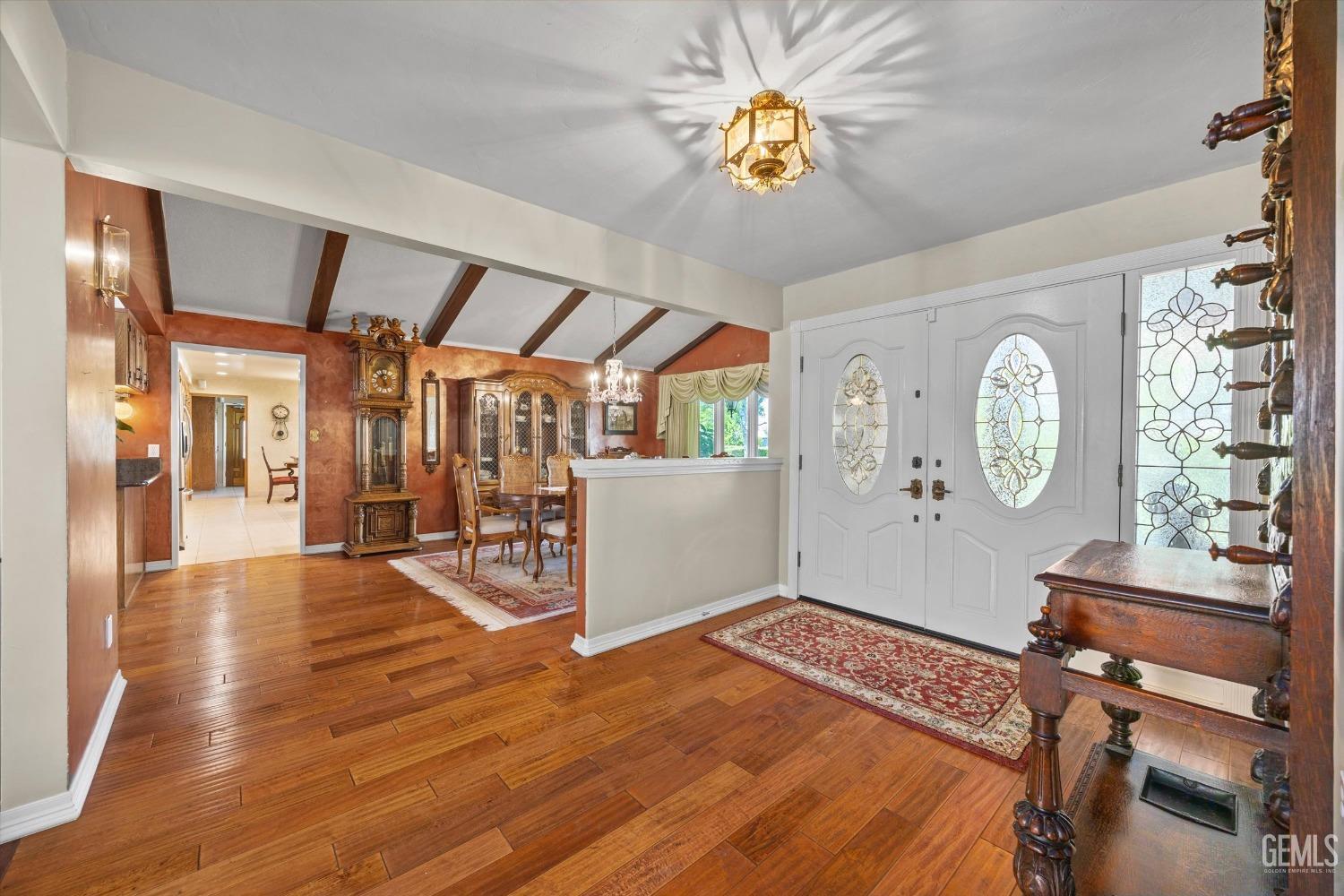 Undisclosed Address Bakersfield, CA 93313 - Photo 6 of 45 a view of a hallway with wooden floor