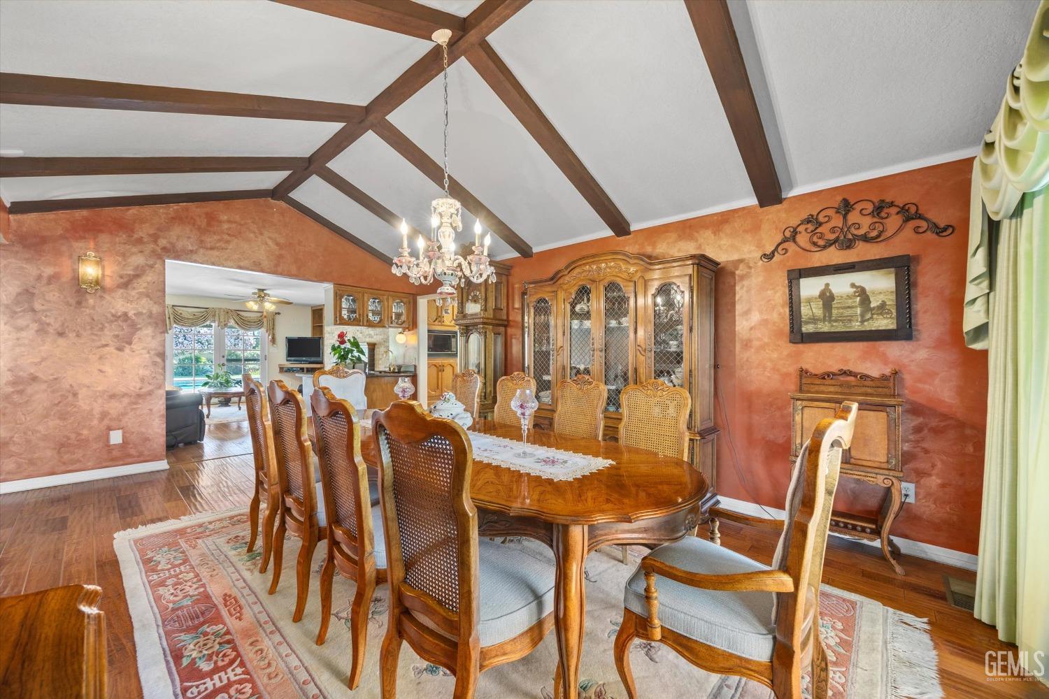 Undisclosed Address Bakersfield, CA 93313 - Photo 8 of 45 a dining room with furniture and wooden floor
