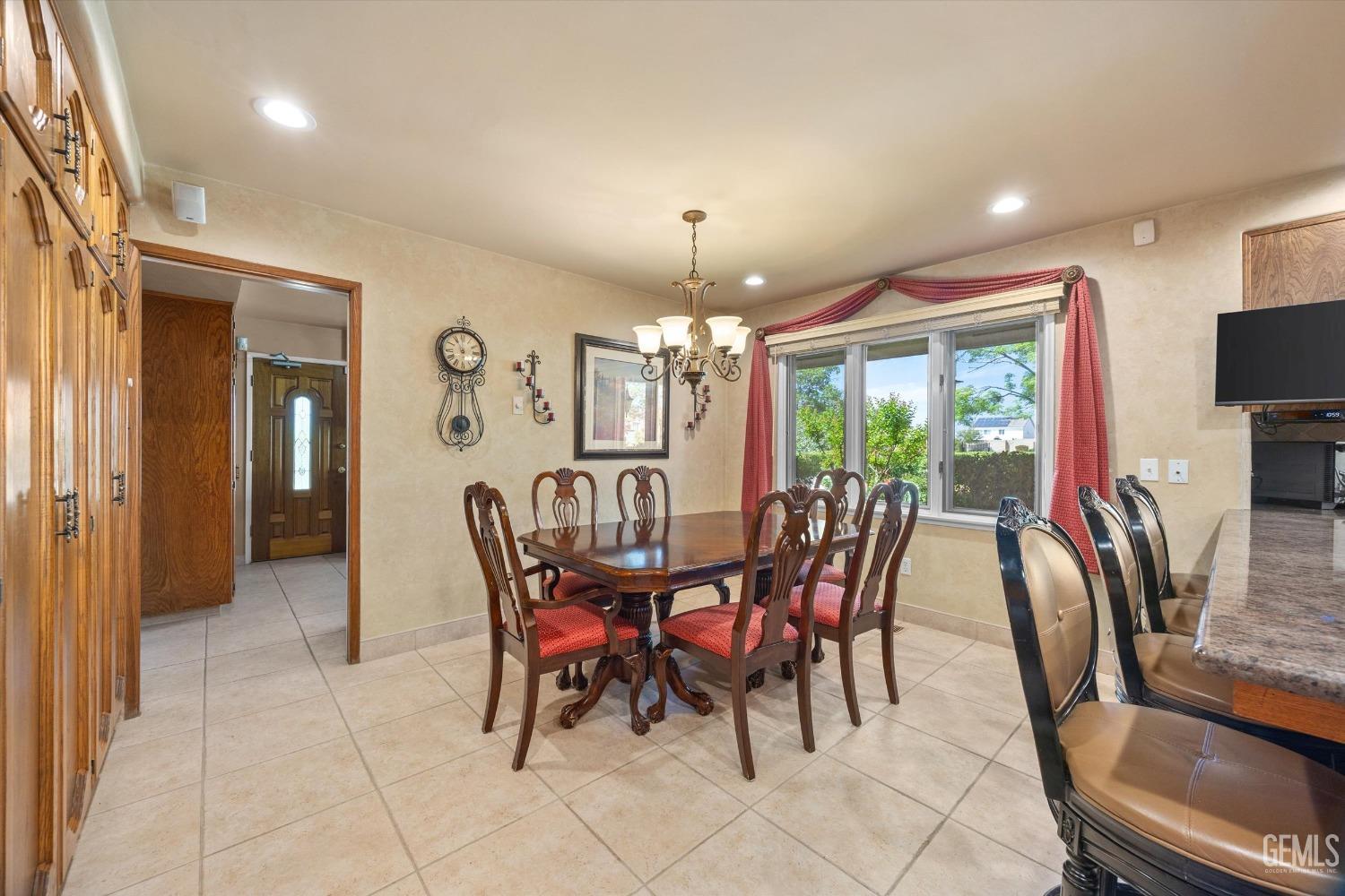 Undisclosed Address Bakersfield, CA 93313 - Photo 10 of 45 a view of a dining room with furniture window and outside view