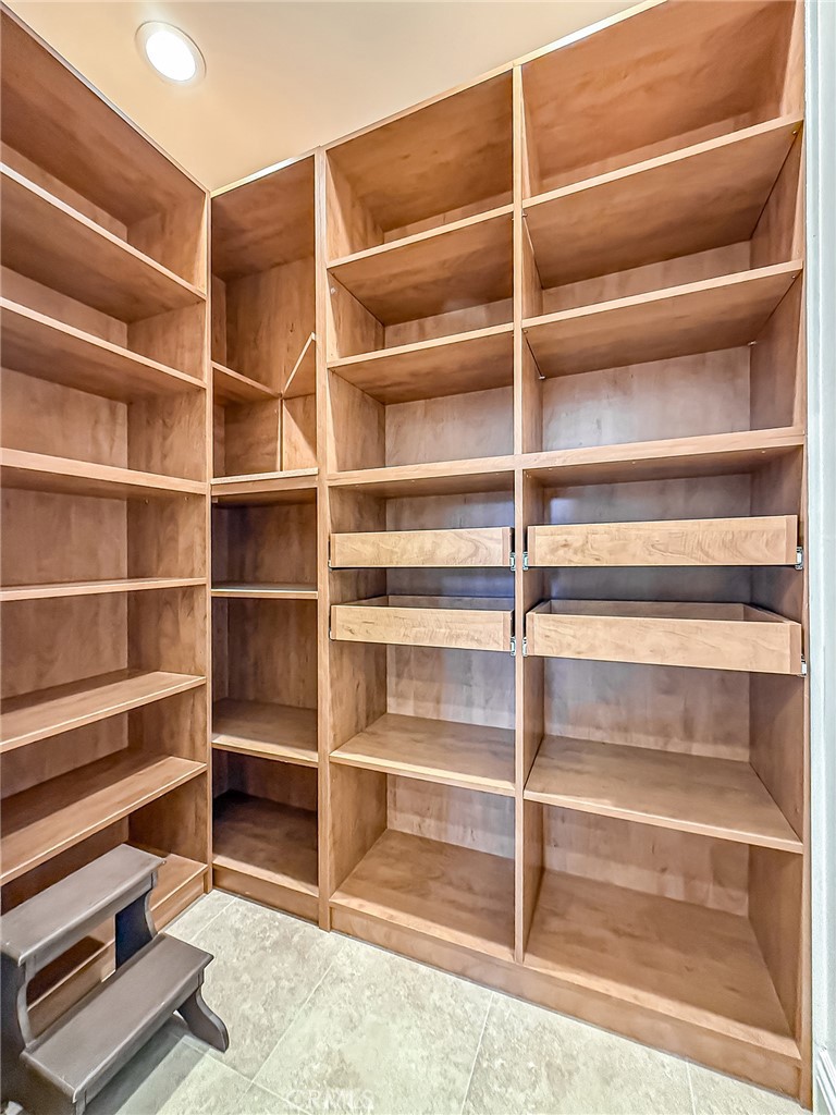 5960 Balcom Avenue Encino, CA 91316 - Photo 19 of 58 a view of walk in closet with empty racks