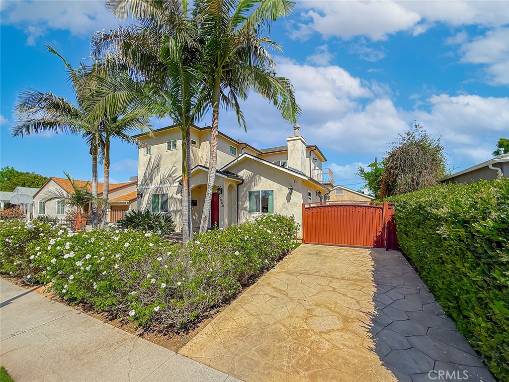 5960 Balcom Avenue Encino, CA 91316 - Photo 2 of 58 a front view of a house with a yard and potted plants
