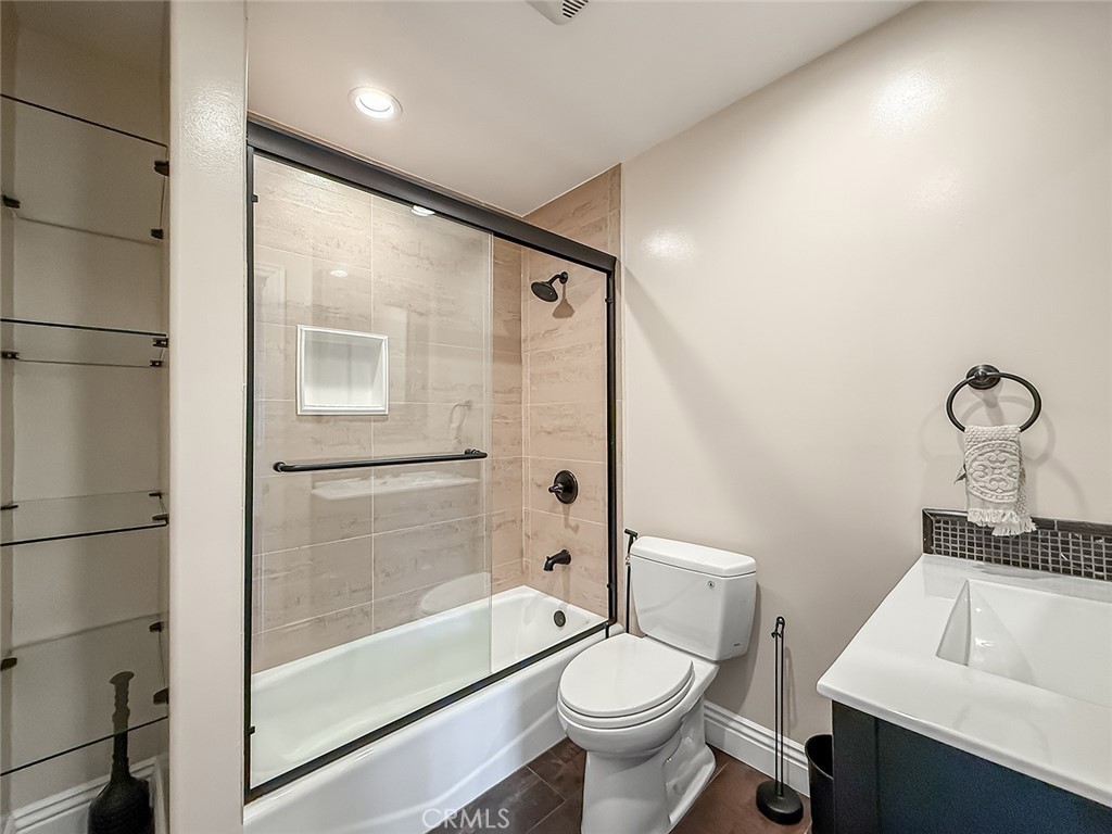 5960 Balcom Avenue Encino, CA 91316 - Photo 21 of 58 a bathroom with a sink toilet and shower