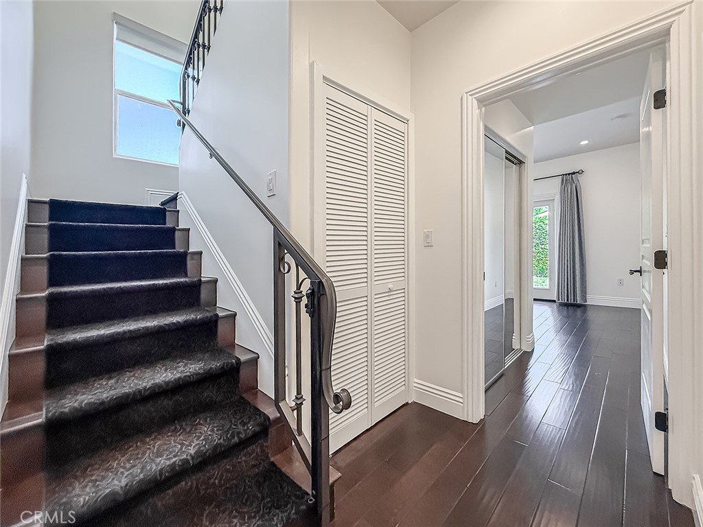 5960 Balcom Avenue Encino, CA 91316 - Photo 23 of 58 a view of a hallway with wooden floor and staircase