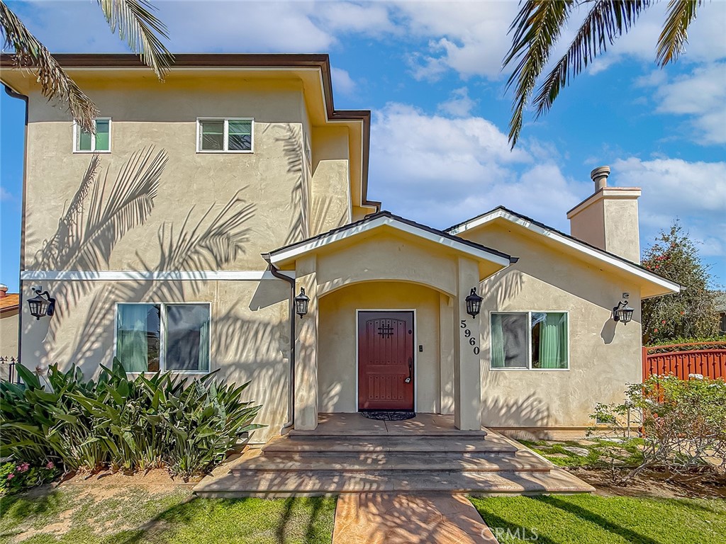 5960 Balcom Avenue Encino, CA 91316 - Photo 3 of 58 a front view of a house with garden