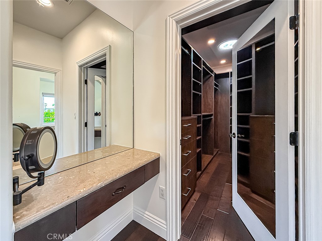 5960 Balcom Avenue Encino, CA 91316 - Photo 36 of 58 a bathroom with a sink a toilet and a mirror