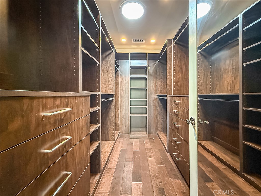 5960 Balcom Avenue Encino, CA 91316 - Photo 37 of 58 a view of walk in closet with clothes