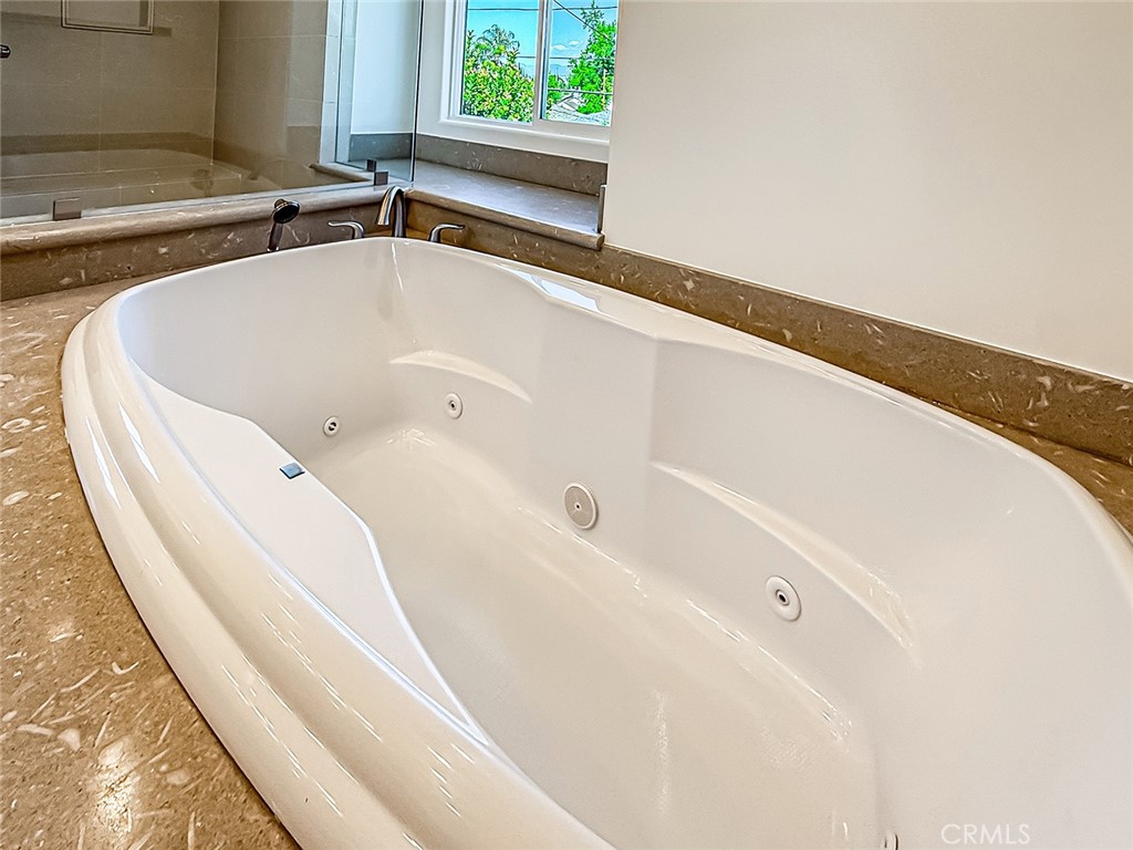 5960 Balcom Avenue Encino, CA 91316 - Photo 40 of 58 a bathroom with a bathtub and a window