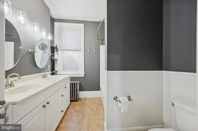 a bathroom with a double vanity sink mirror double and shower