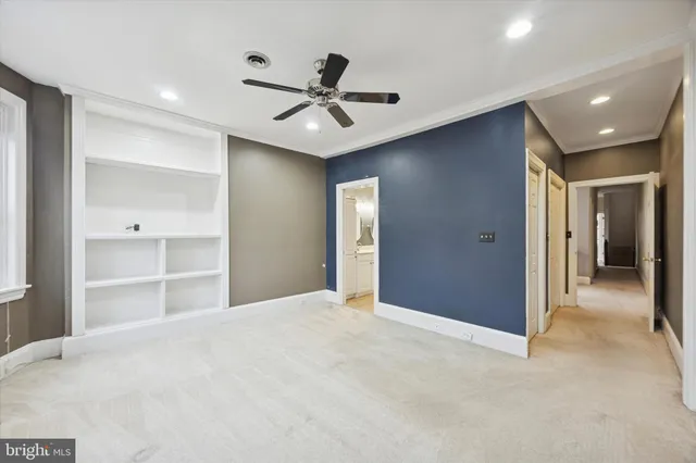 a view of an empty room with a chandelier