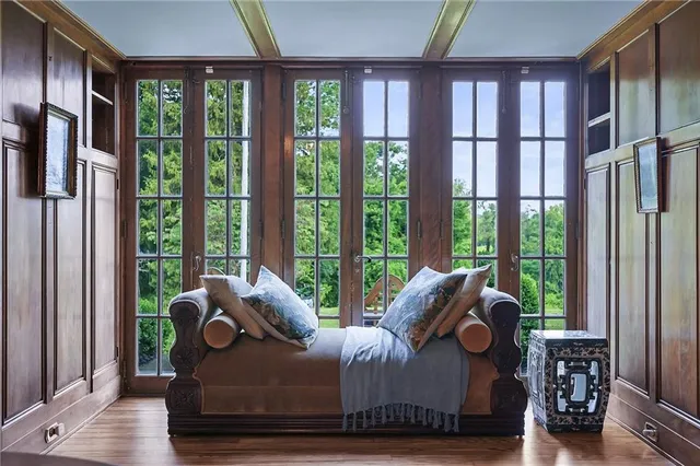 a bathroom with a granite countertop sink a mirror and a shower