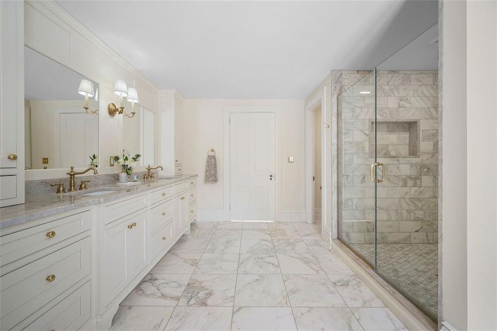526 Scaife Road Sewickley, PA 15143 - Photo 26 of 50 a bathroom with a granite countertop sink a mirror and a shower