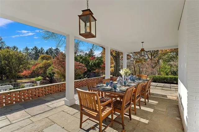 a view of a dining room with furniture and a window