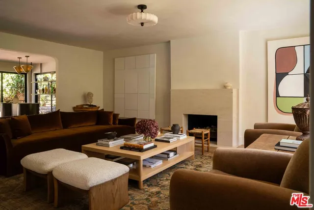 a green field with trees in the background