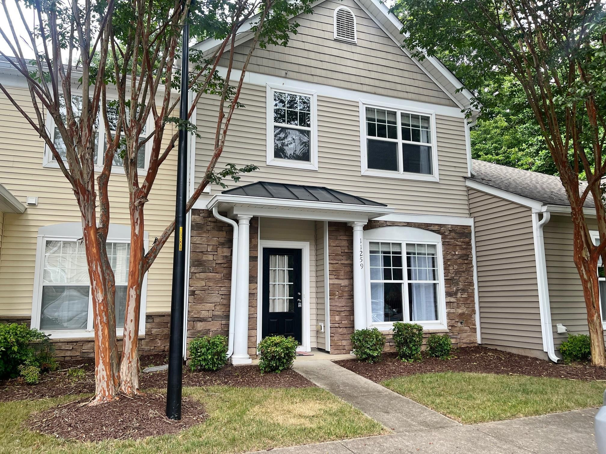 11259 Lofty Heights Place Raleigh, NC 27614 - Photo 1 of 18 a front view of a house with garden