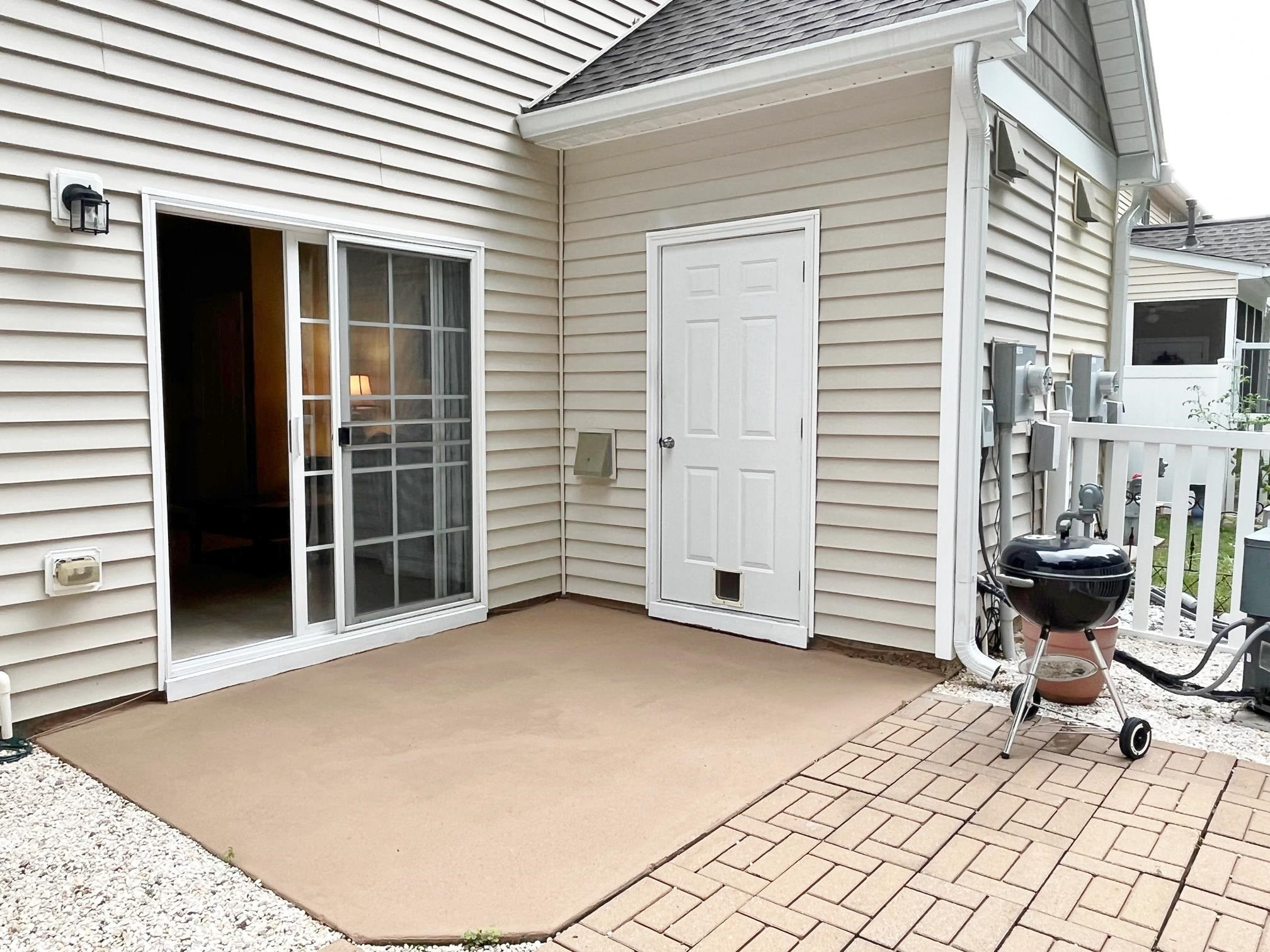 11259 Lofty Heights Place Raleigh, NC 27614 - Photo 15 of 18 a view of a patio with a table and chairs and a barbeque