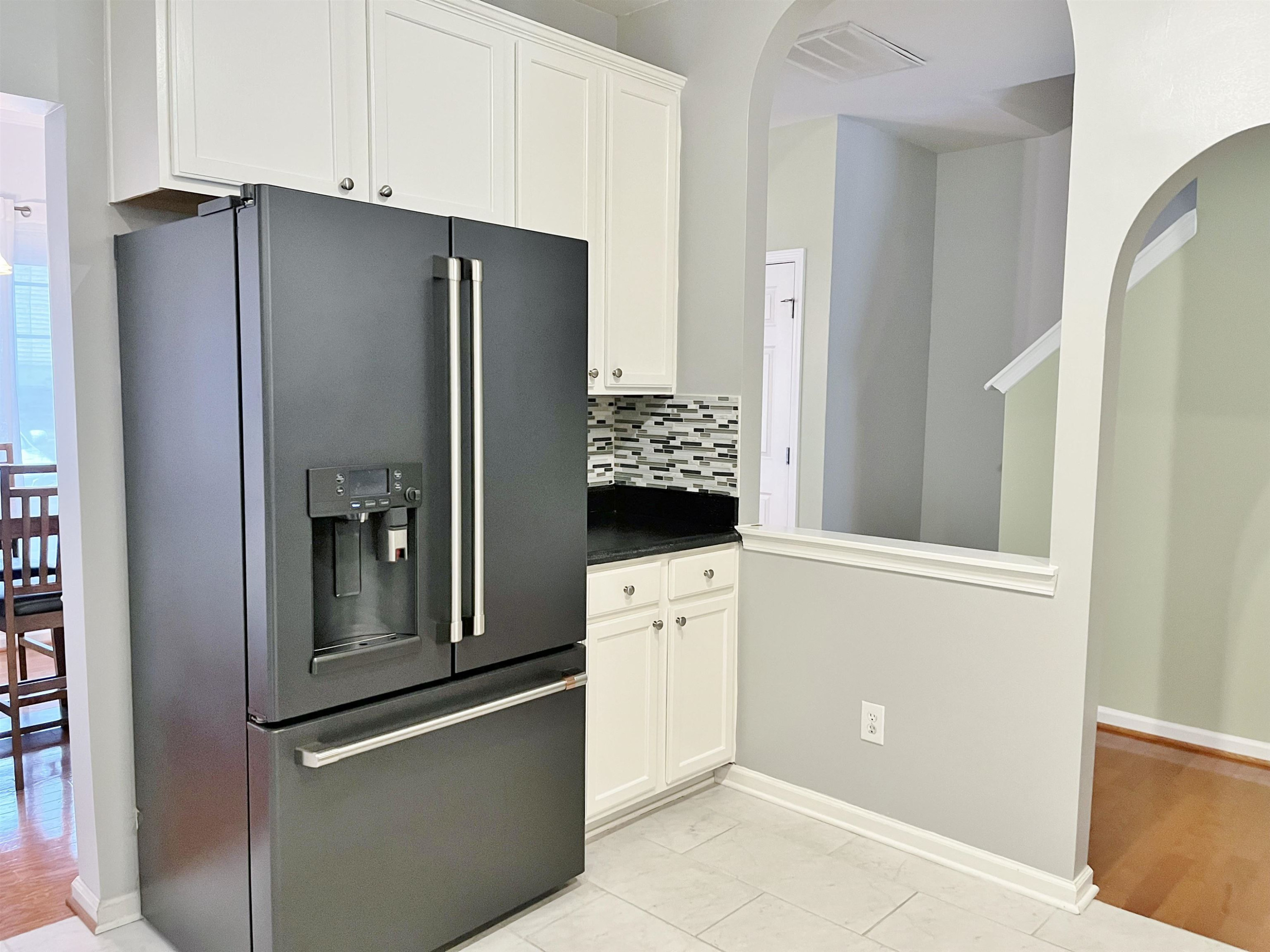 11259 Lofty Heights Place Raleigh, NC 27614 - Photo 5 of 18 a kitchen with a refrigerator and a stove