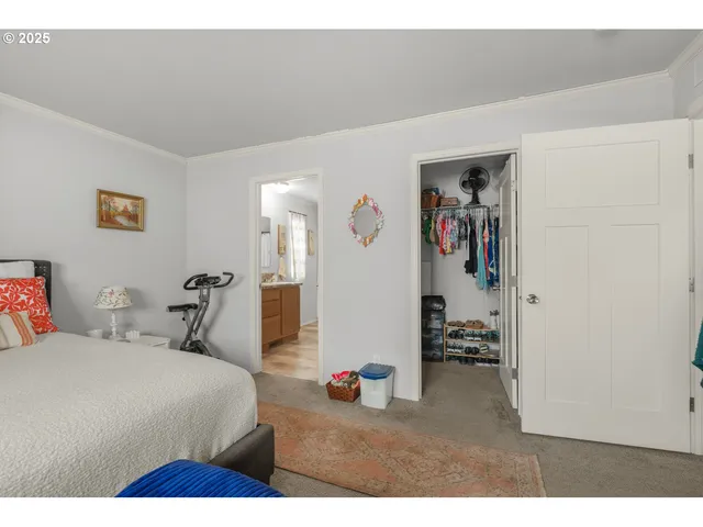 a bathroom with a granite countertop sink a toilet and a shower