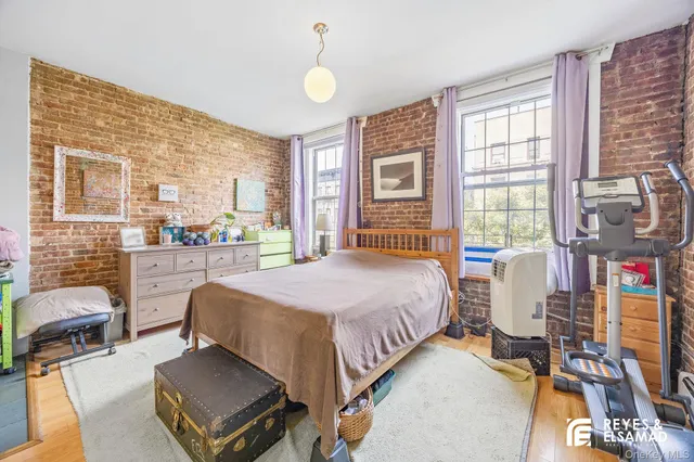 a utility room with lots of wooden furniture and windows