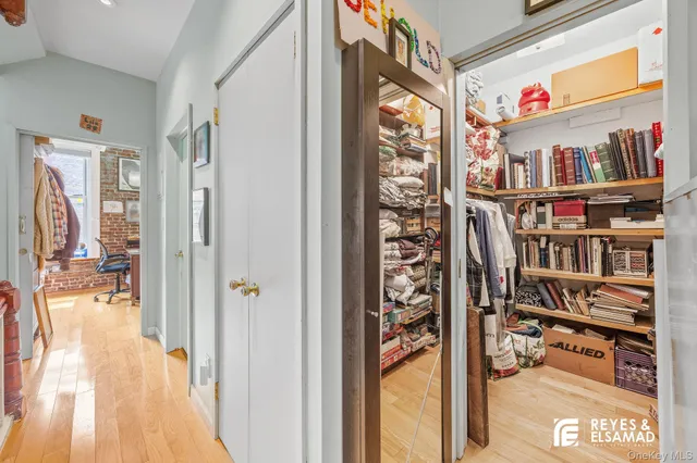 a bedroom with a bed and a table