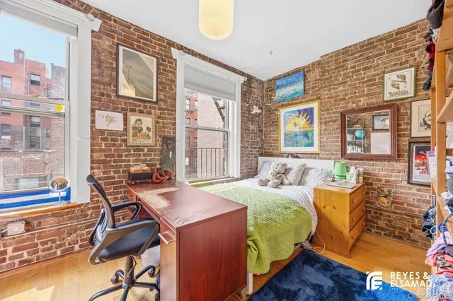 a view of a room with furniture and window