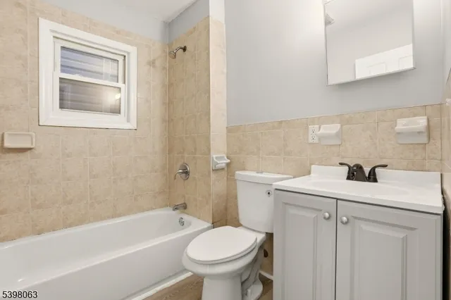 a bathroom with a sink toilet and vanity