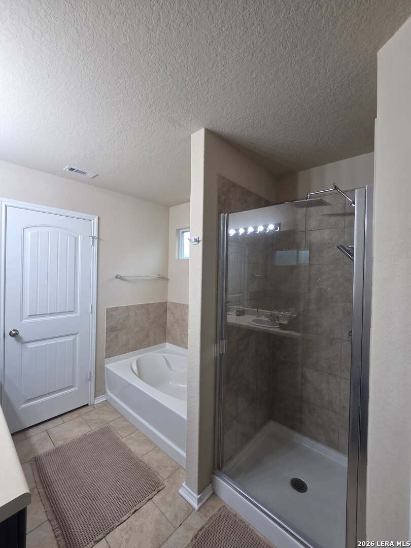 6024 Harvest Ranch San Antonio, TX 78244 - Photo 16 of 31 a bathroom with a bathtub