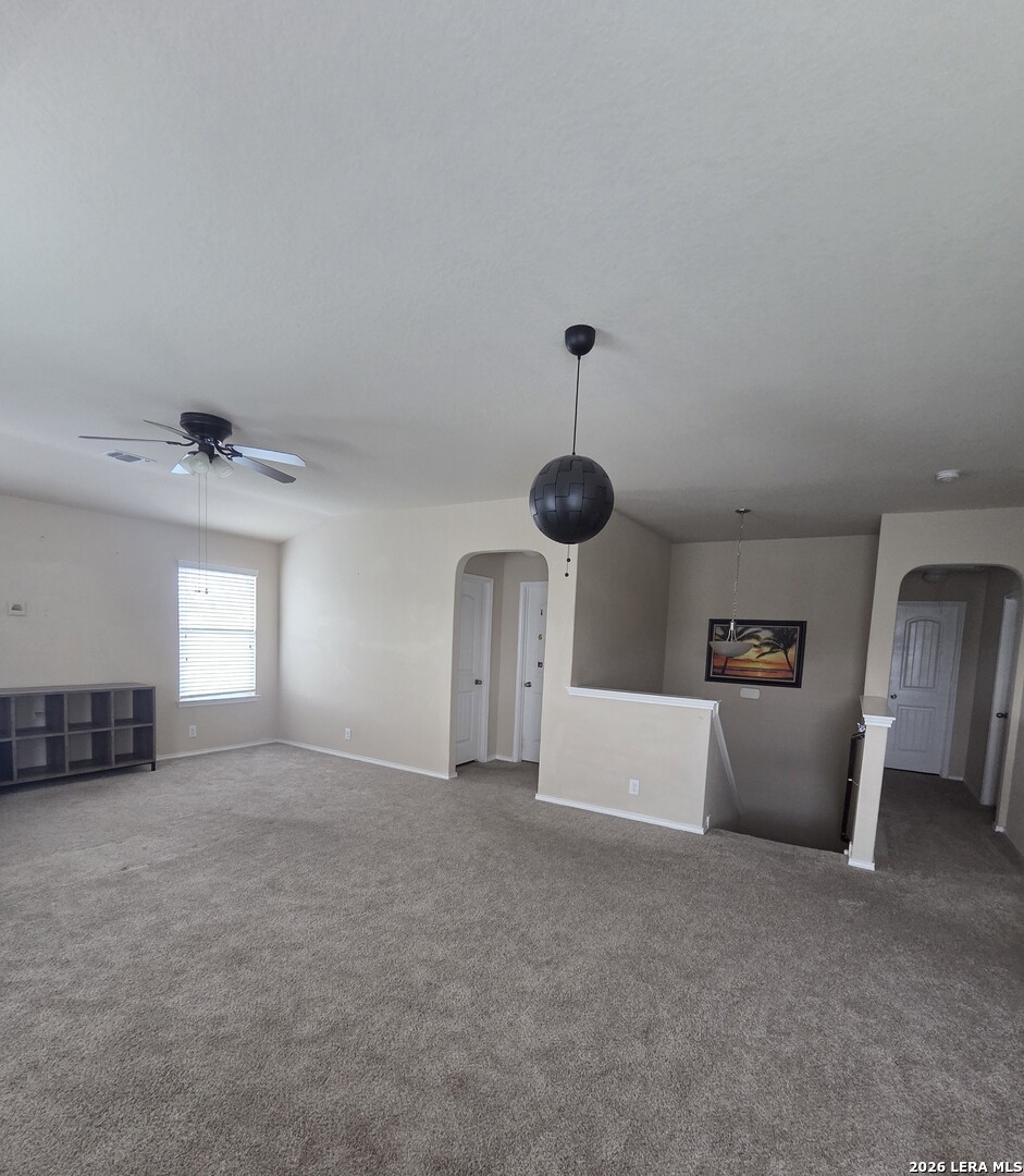 6024 Harvest Ranch San Antonio, TX 78244 - Photo 21 of 31 an empty room with fireplace and windows