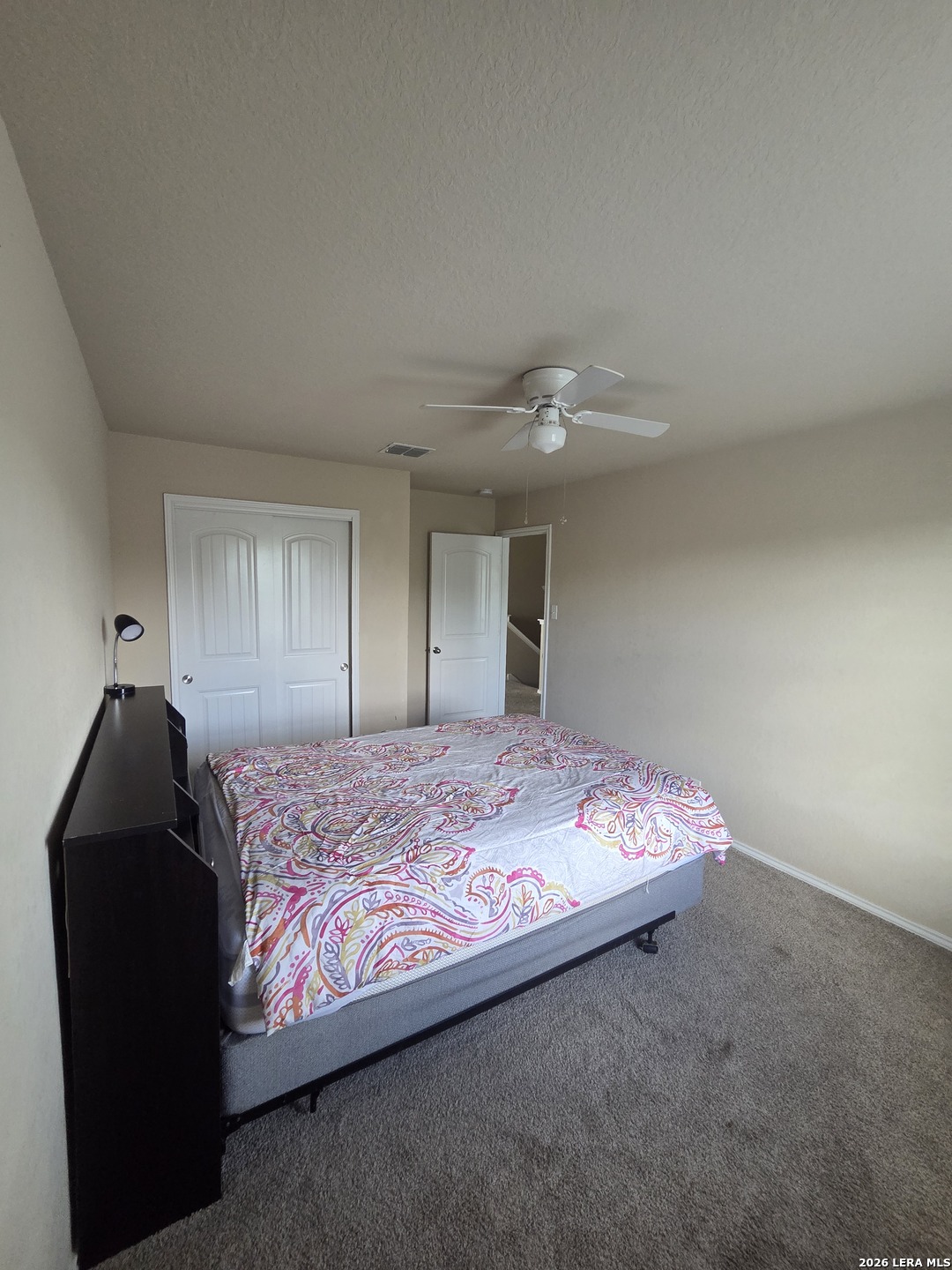 6024 Harvest Ranch San Antonio, TX 78244 - Photo 28 of 31 a bedroom with a bed and a closet