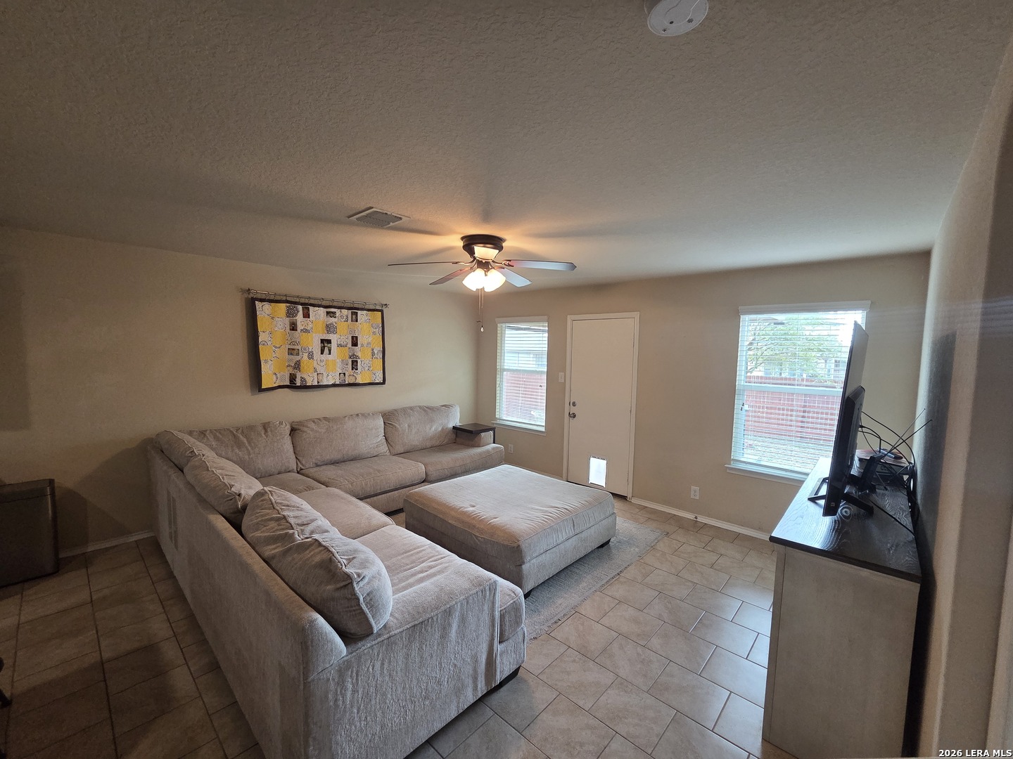 6024 Harvest Ranch San Antonio, TX 78244 - Photo 5 of 31 a living room with furniture and a chandelier