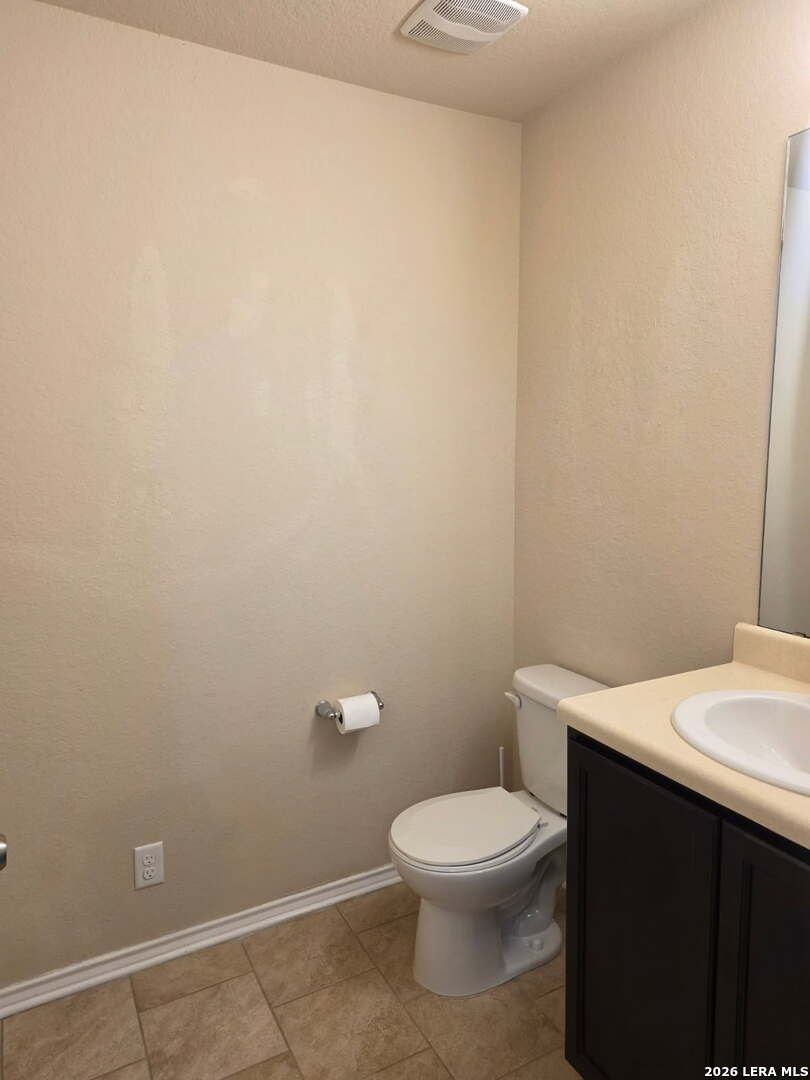 6024 Harvest Ranch San Antonio, TX 78244 - Photo 10 of 31 a white toilet sitting next to a white sink