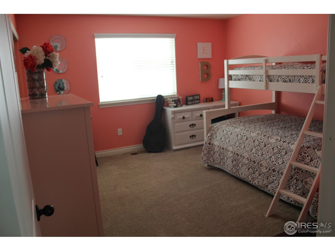 2259 80th Avenue Greeley, CO 80634 - Photo 13 of 21 a room with a bed and a dresser