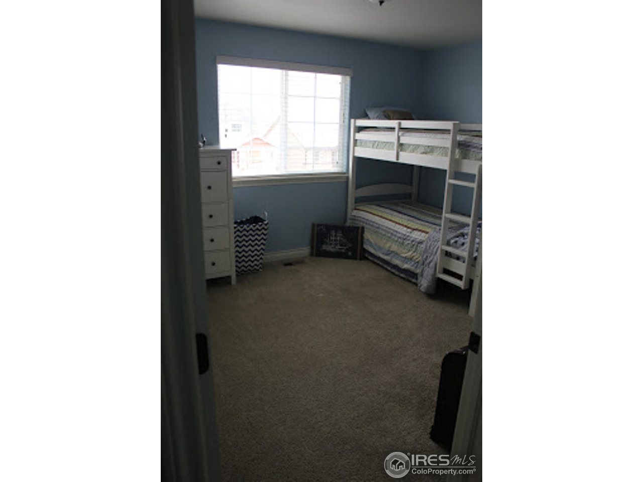2259 80th Avenue Greeley, CO 80634 - Photo 16 of 21 a view of an empty room with a window