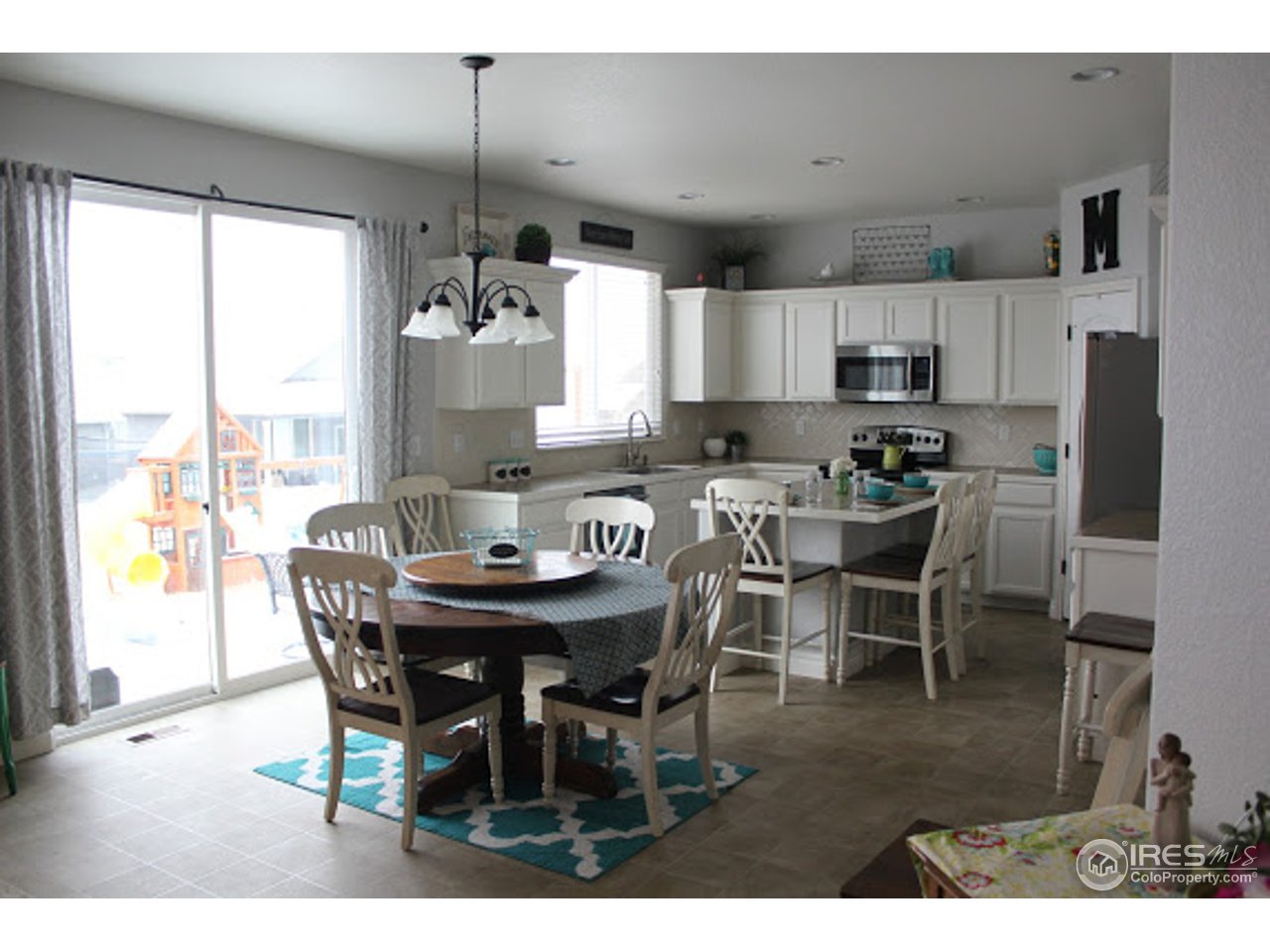 2259 80th Avenue Greeley, CO 80634 - Photo 3 of 21 a dining room with furniture and window