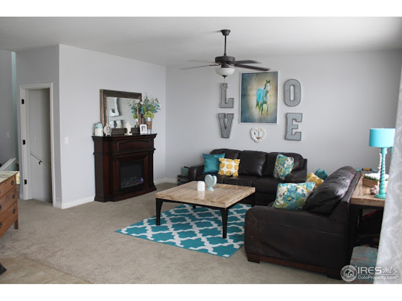 2259 80th Avenue Greeley, CO 80634 - Photo 4 of 21 a living room with furniture and wooden floor