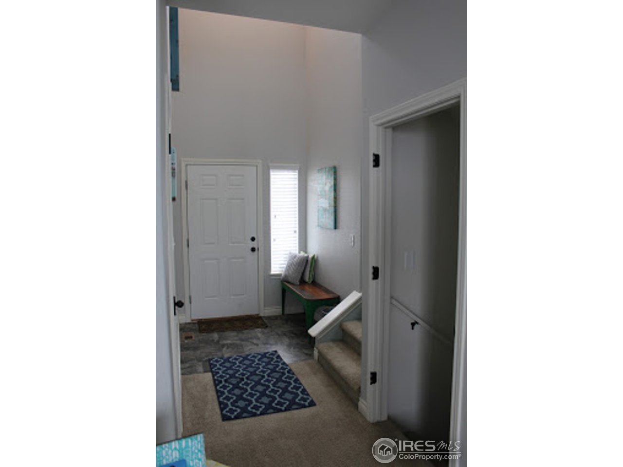 2259 80th Avenue Greeley, CO 80634 - Photo 5 of 21 a room with a cabinet and a rug