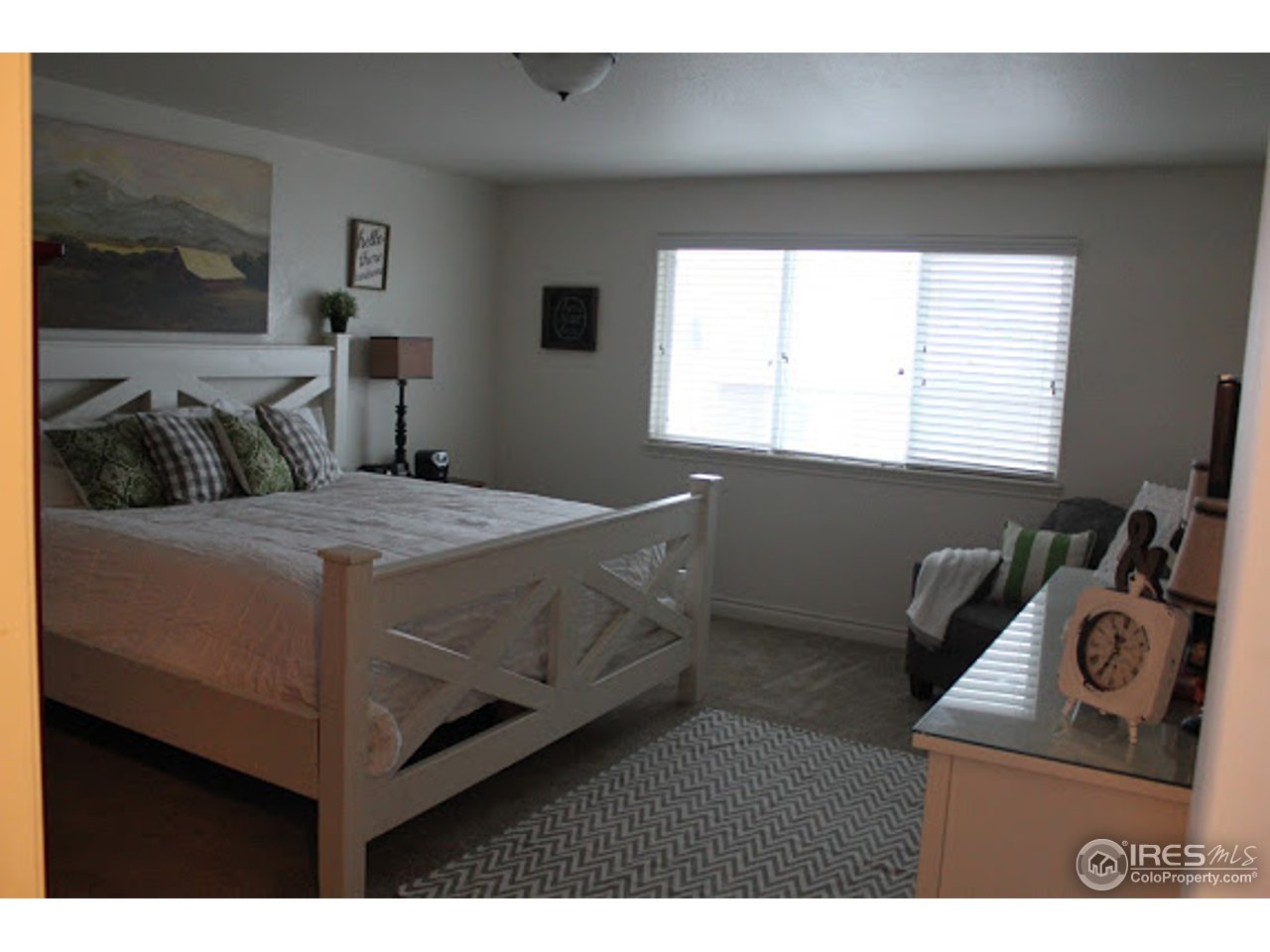 2259 80th Avenue Greeley, CO 80634 - Photo 10 of 21 a bedroom with a bed and window