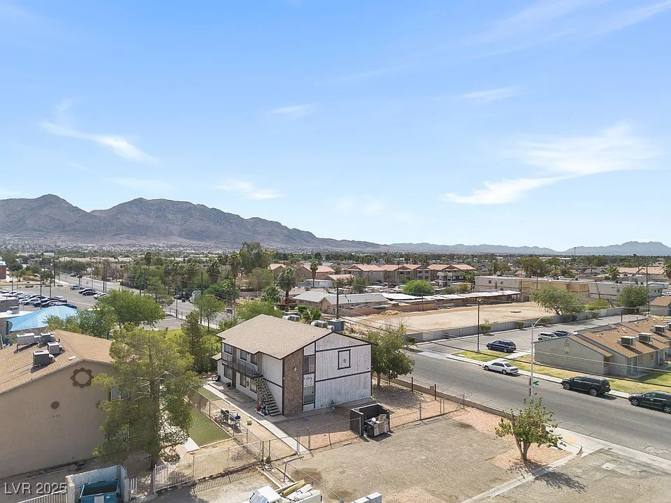 1812 Fulstone Way, Unit 3 Las Vegas, NV 89115 - Photo 12 of 12 Aerial view of residential area featuring a mountainous background