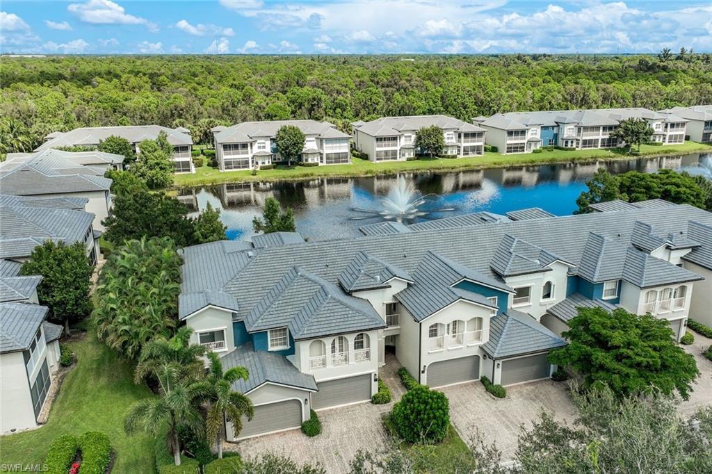 3530 Lansing Loop, Unit 202 Estero, FL 33928 - Photo 10 of 35 an aerial view of a house with a lake view