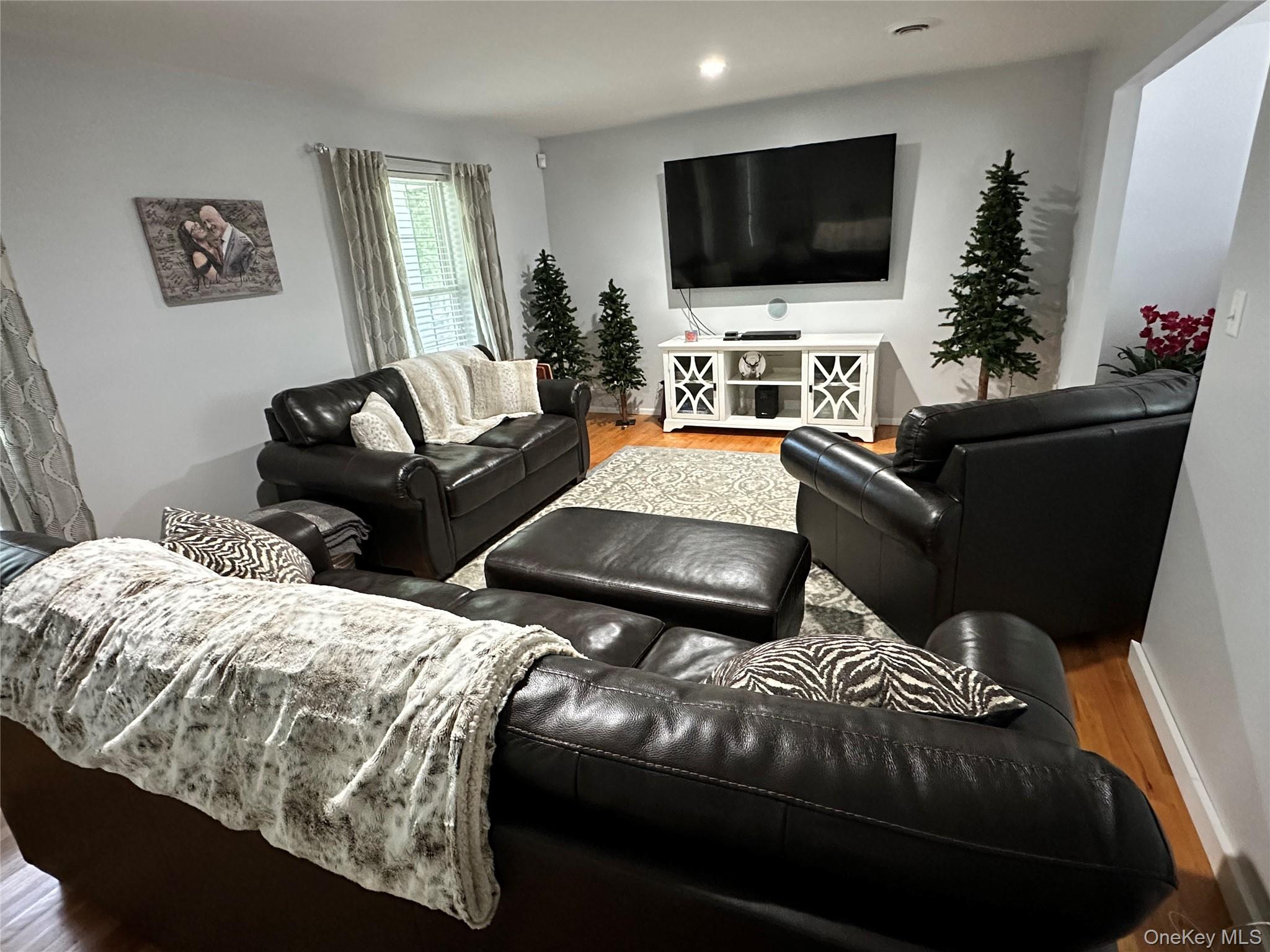 95 Weed Road Pine Bush, NY 12566 - Photo 9 of 31 Spacious living area featuring light-toned wall paint and wood-finish flooring
