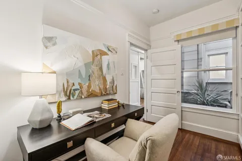 a workspace with furniture and book shelf