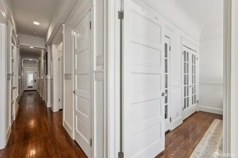 a bedroom with bed and a large window