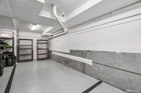 a front view of a residential apartment building with a yard